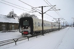 Ic3 trainset MFA 5062/MFB 5262 (named Mathilde Fibiger) photographed in Taulov 24. February 2005.  The Ic3 was built by ABB Scandia in Denmark. Each unit consists of 3 coaches. Built in a number of 92 trainsets. The trainsets were put in service in 1989 - 1998. 4 diesel engines of 294 kW per trainset. Max speed 180 km/h - 112 mph. Length 58 800 mm. Weight 97 metric tonnes. 16 seats 1st class, 128 seats 2nd class. Up to 5 trainsets can be put together. The MFA 5062/MFB 5262 was put in service in 1992.
